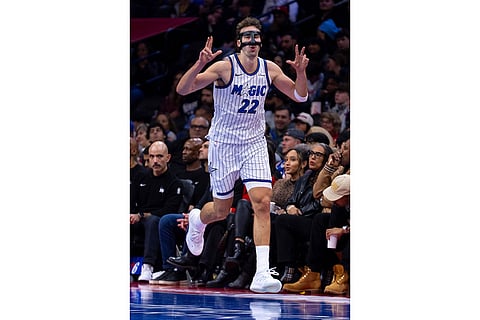 Orlando Magic's Franz Wagner reacts to a three-point basket during the second half of an NBA Cup basketball game against the Philadelphia 76ers in Philadelphia.