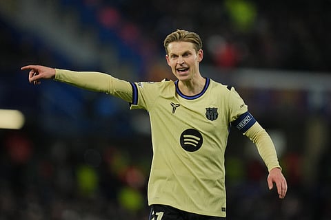 Barcelona's Frenkie de Jong gestures during the Champions League opening phase soccer match between Chelsea and Barcelona in London.