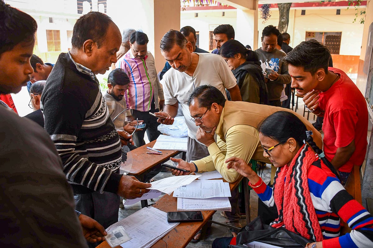 Booth Level Officers check and collect enumeration forms