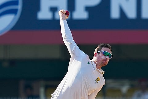 South Africa's Simon Harmer bowls a delivery during the fifth day of the second Test cricket match between India and South Africa, at ACA Stadium, Barsapara in Guwahati.