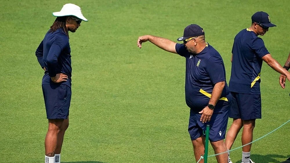 | Photo: AP/Bikas Das : Head coach Shukri Conrad, second right, instructs Tony de Zorzi, left, during the practice session ahead of the first test match between India and South Africa, in Kolkata.