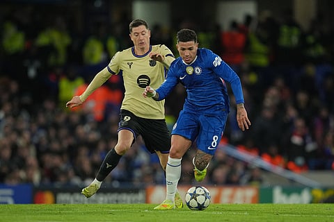 Chelsea's Enzo Fernandez, right, is challenged by Barcelona's Robert Lewandowski during the Champions League opening phase soccer match between Chelsea and Barcelona in London.