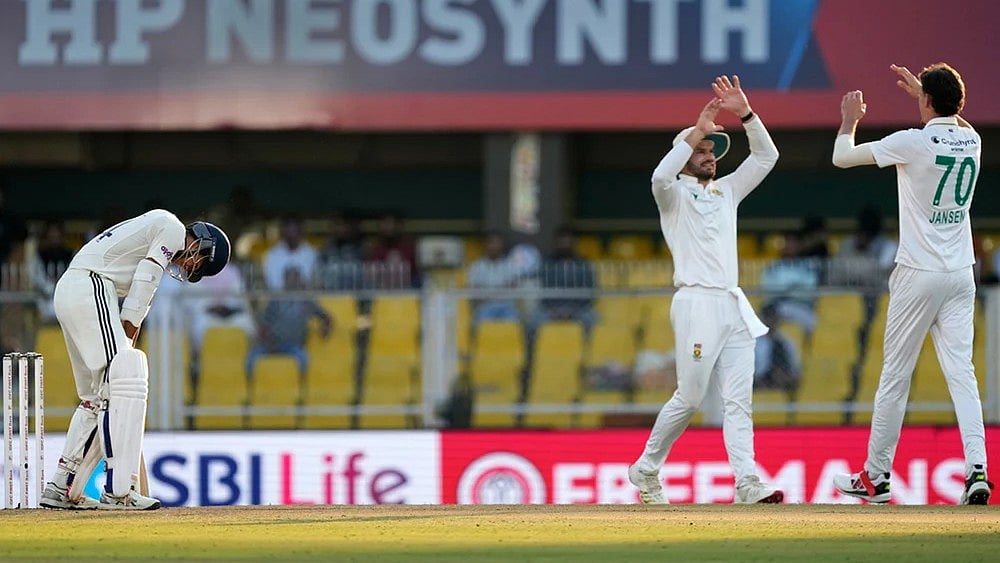 | Photo: AP/Anupam Nath : South Africa's Marco Jansen, right, celebrates with teammates after the dismissal of India's Yashasvi Jaiswal, left, on the fourth day of the second cricket test match between India and South Africa in Guwahati.