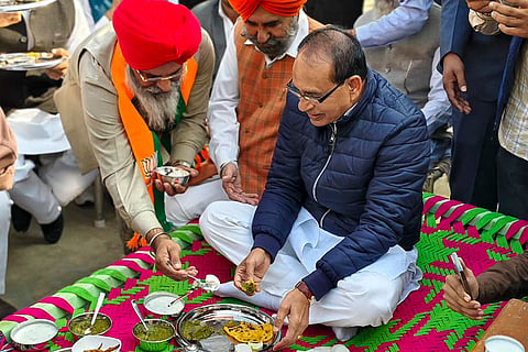 Union Minister for Agriculture and Farmers' Welfare Shivraj Singh Chouhanbeing served food during an interaction with farmers and villagers, in Moga, Punjab.