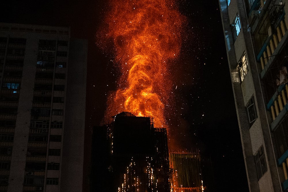 Flames engulf a building after a fire broke out at Wang Fuk Court, a residential estate in the Tai Po district of Hong Kong's New Territories. - | Photo: AP/Chan Long Hei
