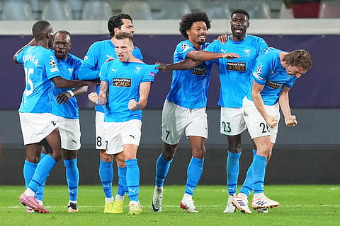 Pafos' players celebrate after Monaco's Mohammed Salisu scored an own goal during the Champions League opening phase soccer match between Pafos FC and AS Monaco in Limassol, Cyprus.