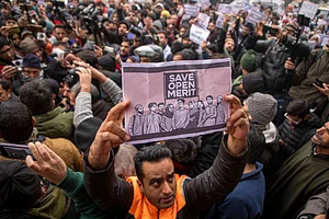 ZUMA Wire : A Kashmiri man holds a placard during a protest outside the chief minister’s official residence in Srinagar against Jammu and Kashmir’s reservation policy.