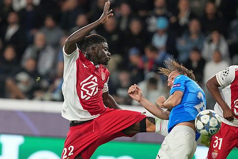 Monaco's Mohammed Salisu, left, in action against Pafos' Ivan Sunjic during the Champions League opening phase soccer match between Pafos FC and AS Monaco in Limassol, Cyprus.