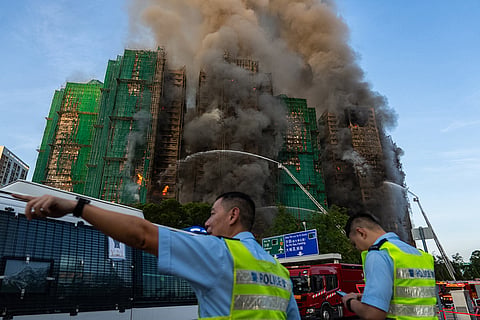 First responders work the scene of a fire at Wang Fuk Court, a residential estate in the Tai Po district of Hong Kong's New Territories.