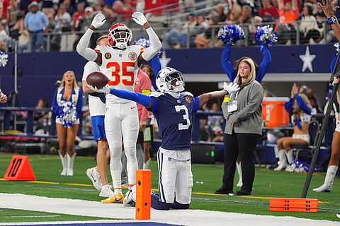Dallas Cowboys wide receiver George Pickens (3) celebrates after catching a two-point conversion as Kansas City Chiefs cornerback Jaylen Watson (35) reacts during the second half of an NFL football game in Arlington, Texas. 