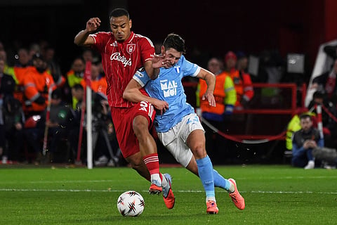 Nottingham Forest's Murillo, left, vies for the ball with Malmo's Lasse Berg Johnsen during the Europa League opening phase soccer match between Nottingham Forest and Malmo in Nottingham, England.