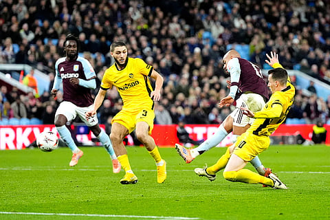 Aston Villa's Donyell Malen, second right, scores his side's second goal during the Europa League soccer match between Aston Villa and Young Boys in Birmingham, England.