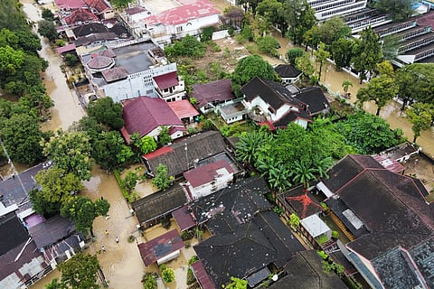 This aerial shot taken using a drone shows a flooded neighborhood in Medan, North Sumatra, Indonesia.