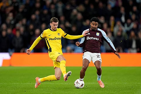 Young Boys' Darian Males, left, and Aston Villa's Ian Maatsen, right, challenge for the ball during  the Europa League soccer match between Aston Villa and Young Boys in Birmingham, England.