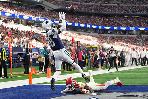 Dallas Cowboys wide receiver CeeDee Lamb (88) catches a touchdown pass as Kansas City Chiefs cornerback Trent McDuffie (22) defends during the first half of an NFL football game in Arlington, Texas. 