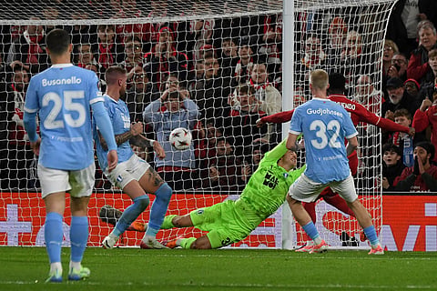 Nottingham Forest's Arnaud Kalimuendo, right, scores his sides second goal during the Europa League opening phase soccer match between Nottingham Forest and Malmo in Nottingham, England.
