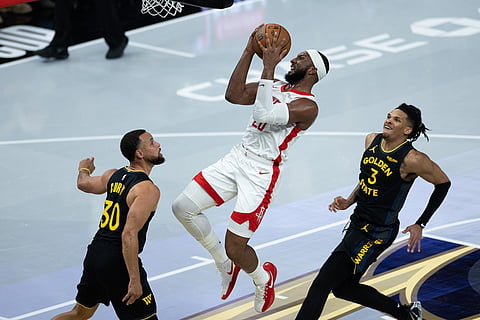 Houston Rockets guard Josh Okogie shoots past by Golden State Warriors guard Stephen Curry (30) during the first half of an Emirates NBA Cup basketball game in San Francisco. 