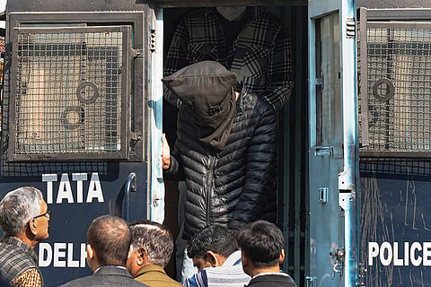 An accused being brought to the Patiala House Court in connection with the Red Fort blast case, in New Delhi.