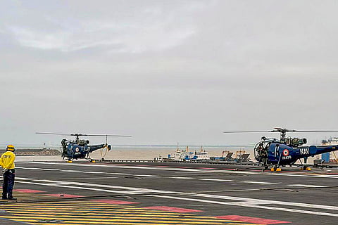 INS Vikrant's two Chetak helicopters with Sri Lankan Air Force personnel on board take off for search and rescue operations as part of 'Operation Sagar Bandhu', in cyclone-hit Sri Lanka. 