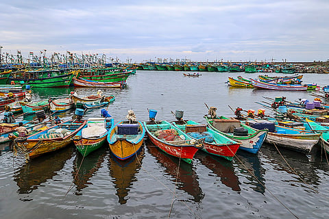 Boats moored at the shore amid gusty winds in view of Cyclone 'Ditwah', at Kasimedu fishing harbour, in Chennai.