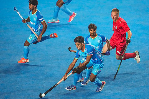 Players of India (in blue) and Chile vie for the ball during the FIH Hockey Men's Junior World Cup 2025 match, at Mayor Radhakrishnan Hockey Stadium, in Chennai, Tamil Nadu.