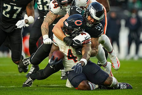 Philadelphia Eagles linebacker Zack Baun (53) tackles Chicago Bears running back D'Andre Swift (4) during the first half of an NFL football game, in Philadelphia. 