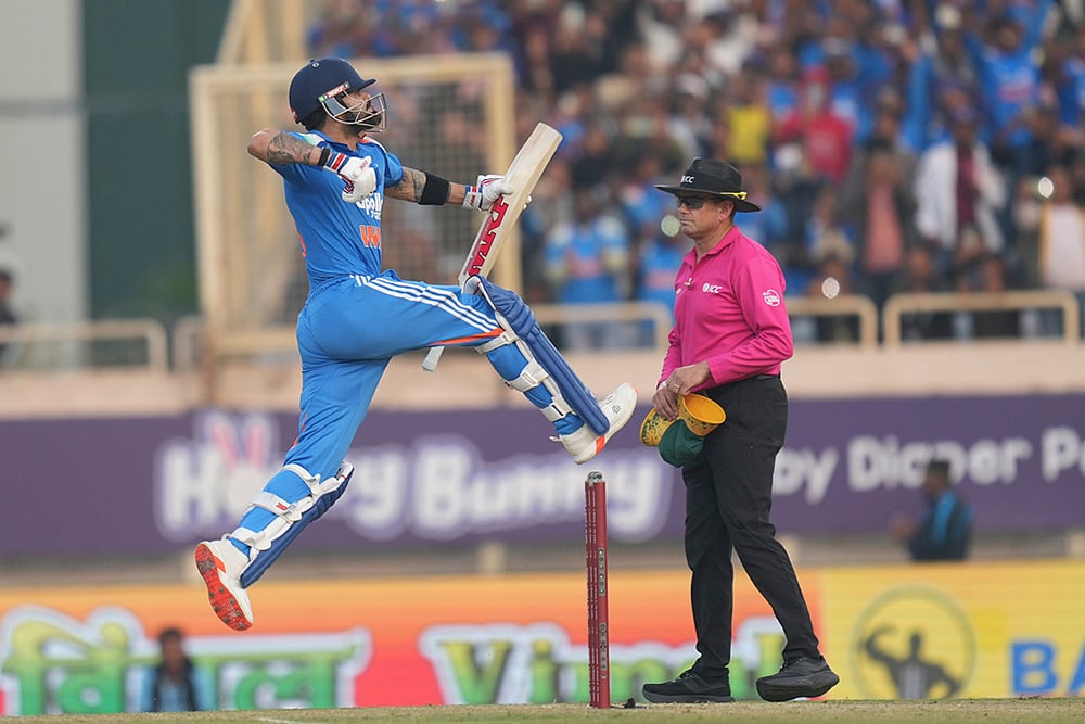 | Photo: AP/Rafiq Maqbool : India's Virat Kohli celebrates his century during the first One Day International match between India and South Africa in Ranchi.