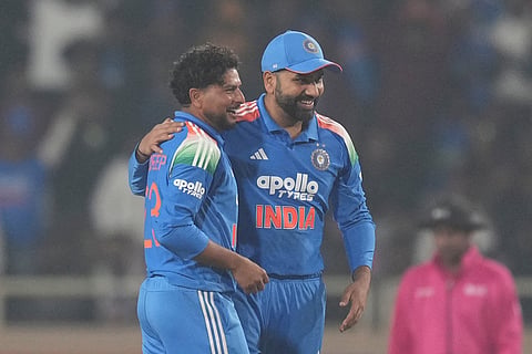 India's Kuldeep Yadav, left, and India's Rohit Sharma celebrates the wicket of South Africa's Matthew Breetzke during the first One Day International match between India and South Africa in Ranchi.