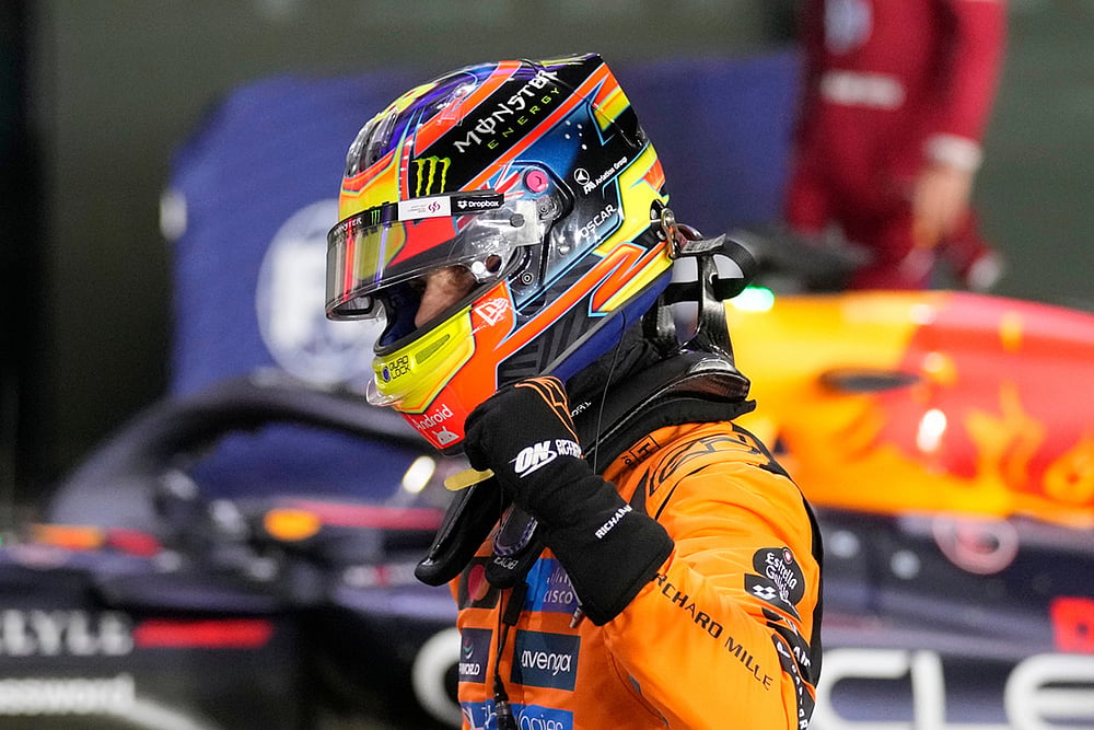 | Photo: AP/Darko Bandic : McLaren driver Oscar Piastri of Australia celebrates after setting the pole position in the second qualifying session at the Lusail International Circuit ahead of the Qatar Formula One Grand Prix, in Lusail, Qatar.