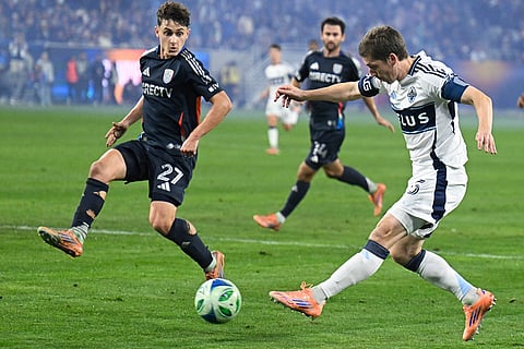 Vancouver Whitecaps midfielder Ryan Gauld (25) shoots past San Diego FC defender Luca Bombino (27) during the second half of an MLS Western Conference final soccer match in San Diego. 