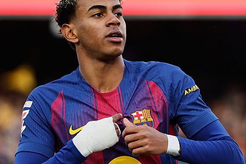 Barcelona's Lamine Yamal celebrates after scoring his side's first goal during a Spanish La Liga soccer match between Barcelona and Alaves, in Barcelona, Spain.