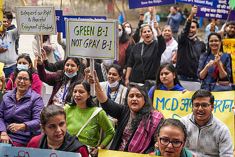 Residents of Sector B, Pocket 1, Vasant Kunj, raise slogans during a protest against the proposed construction of multi-storey buildings in the area, at Jantar Mantar, in New Delhi.