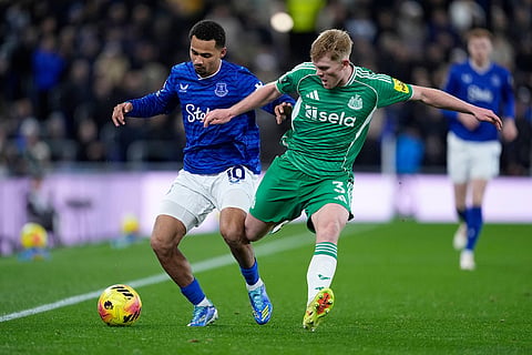 Everton's Iliman Ndiaye, left, and Newcastle United's Lewis Hall in action during the English Premier League soccer match between Everton and Newcastle United in Liverpool, England.
