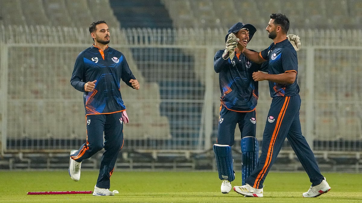 PTI : Jammu and Kashmir's Auqib Nabi, right, celebrates with teammates after taking the wicket of Bihar's Vaibhav Suryavanshi during a Syed Mushtaq Ali Trophy 2025 match in in Kolkata.