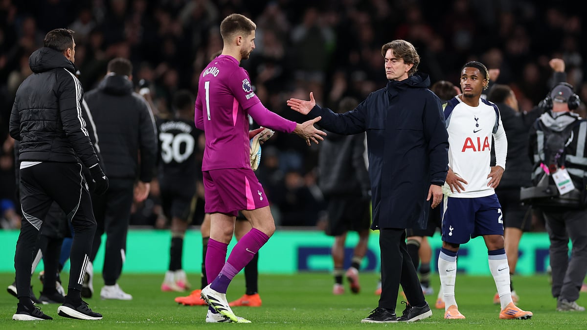 Guglielmo Vicario shakes hands with Thomas Frank after Saturday's loss to Fulham