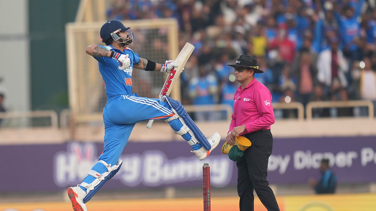 (AP Photo/Rafiq Maqbool) : India's Virat Kohli celebrates his century during the first One Day International match between India and South Africa in Ranchi, India, Sunday, Nov. 30, 2025.