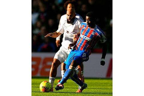 Manchester United's Bryan Mbeumo, left, and Crystal Palace's Marc Guehi during the English Premier League soccer match between Crystal Palace and Manchester United in London.