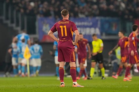 Roma's Evan Ferguson stands after Napoli's David Neres scored his side's first goal during the Serie A soccer match between Roma and Napoli in Rome.
