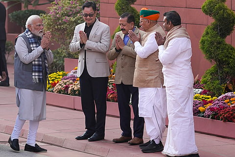Prime Minister Narendra Modi arrives on the first day of the Winter Session of Parliament, in New Delhi. Union Ministers Kiren Rijiju, Jitendra Singh, Arjun Ram Meghwal, L Murugan are also seen. 