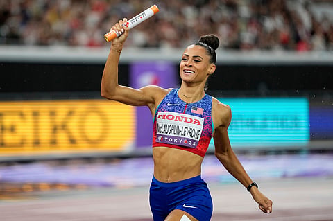 FILE - Sydney McLaughlin-Levrone crosses the finish line to win the women's 4 X 400 meters relay at the World Athletics Championships in Tokyo, Sept. 21, 2025.