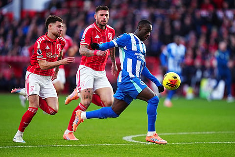Brighton and Hove Albion's Yankuba Minteh controls a ball, during the English Premier League soccer match between Nottingham Forest and Bright and Hove Albion,  at the City Ground, in Nottingham, England.