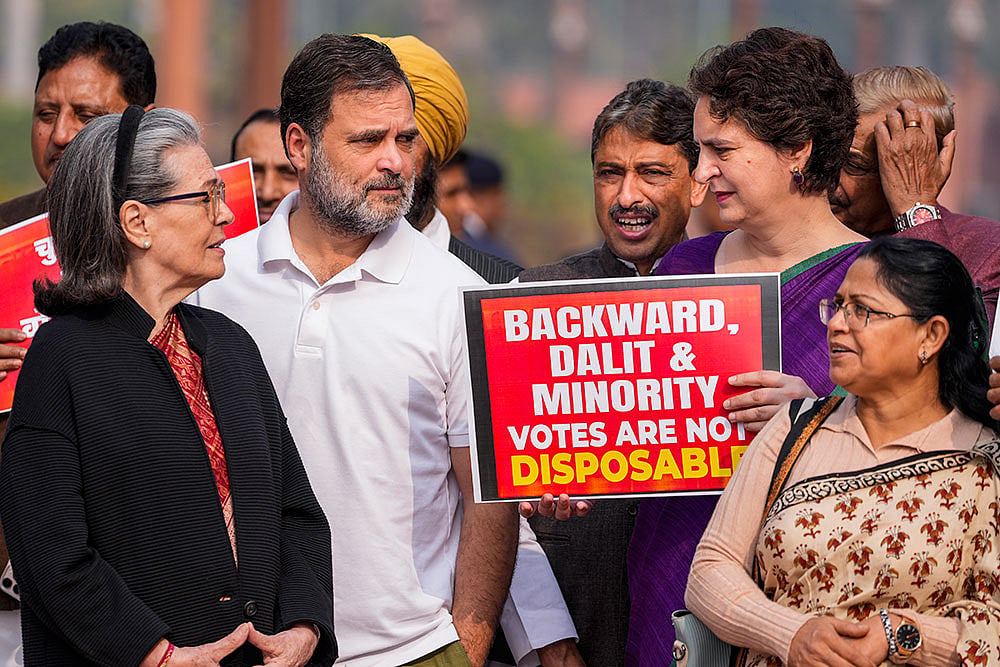 | Photo: PTI/Ravi Choudhary : LoP in the Lok Sabha and Congress leader Rahul Gandhi, party's General Secretary Priyanka Gandhi Vadra and leader Sonia Gandhi during a protest against Special Intensive Revision (SIR) at Parliament complex during Winter session, in New Delhi.