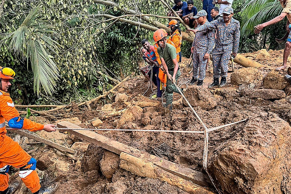 Photo: @IndiainSL/X via PTI : In this image, Rescue workers and National Disaster Response Force (NDRF) personnel during Operation Sagar Bandhu, India's rescue initiative in Sri Lanka following cyclone Ditwah, in Badulla, Sri Lanka.