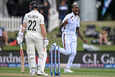 West Indies' Justin Greaves, right, celebrates taking the wicket of New Zealand's Kane Williamson during their cricket test match in Christchurch, New Zealand.
