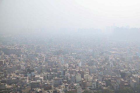 A thick layer of smog engulfs the city, in Noida, Uttar Pradesh.