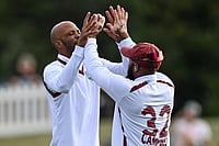 | Photo: John Davidson/Photosport via AP : West Indies' Roston Chase, left, and teammate John Campbell celebrate after taking the wicket of New Zealand's Nathan Smith during their cricket test match in Christchurch, New Zealand.