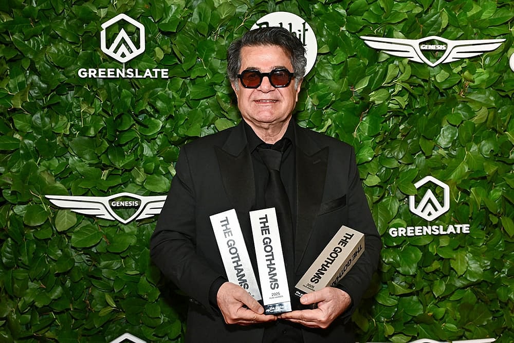 Photo by Evan Agostini/Invision/AP : Jafar Panahi poses with the awards for best international feature, best original screenplay and best director at The Gotham Film Awards at Cipriani Wall Street in New York.