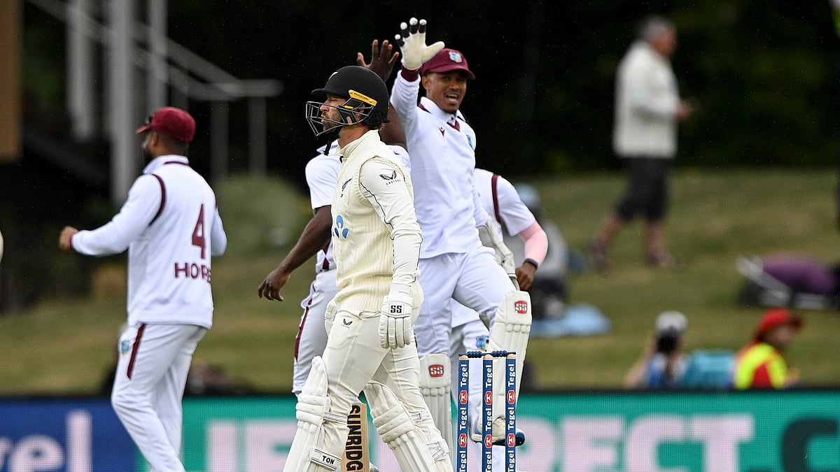 Andrew Cornaga/Photosport via AP : West Indies Tevin Imlach, right, celebrates the wicket of New Zealand's Devon Conway, center, during their cricket test match in Christchurch