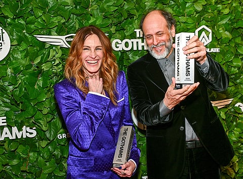 Julia Roberts, left, and Luca Guadagnino pose with the film tribute award at The Gotham Film Awards at Cipriani Wall Street in New York. 