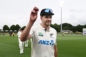 | Photo: Andrew Cornaga/Photosport via AP : New Zealand's Jacob Duffy hold up the ball after taking 5 wickets against the West Indies during the second day of their cricket test match in Christchurch, New Zealand.